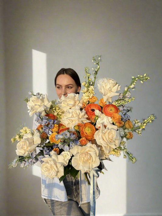 «Sunshine» roses, delphinium, ranunculus, stock