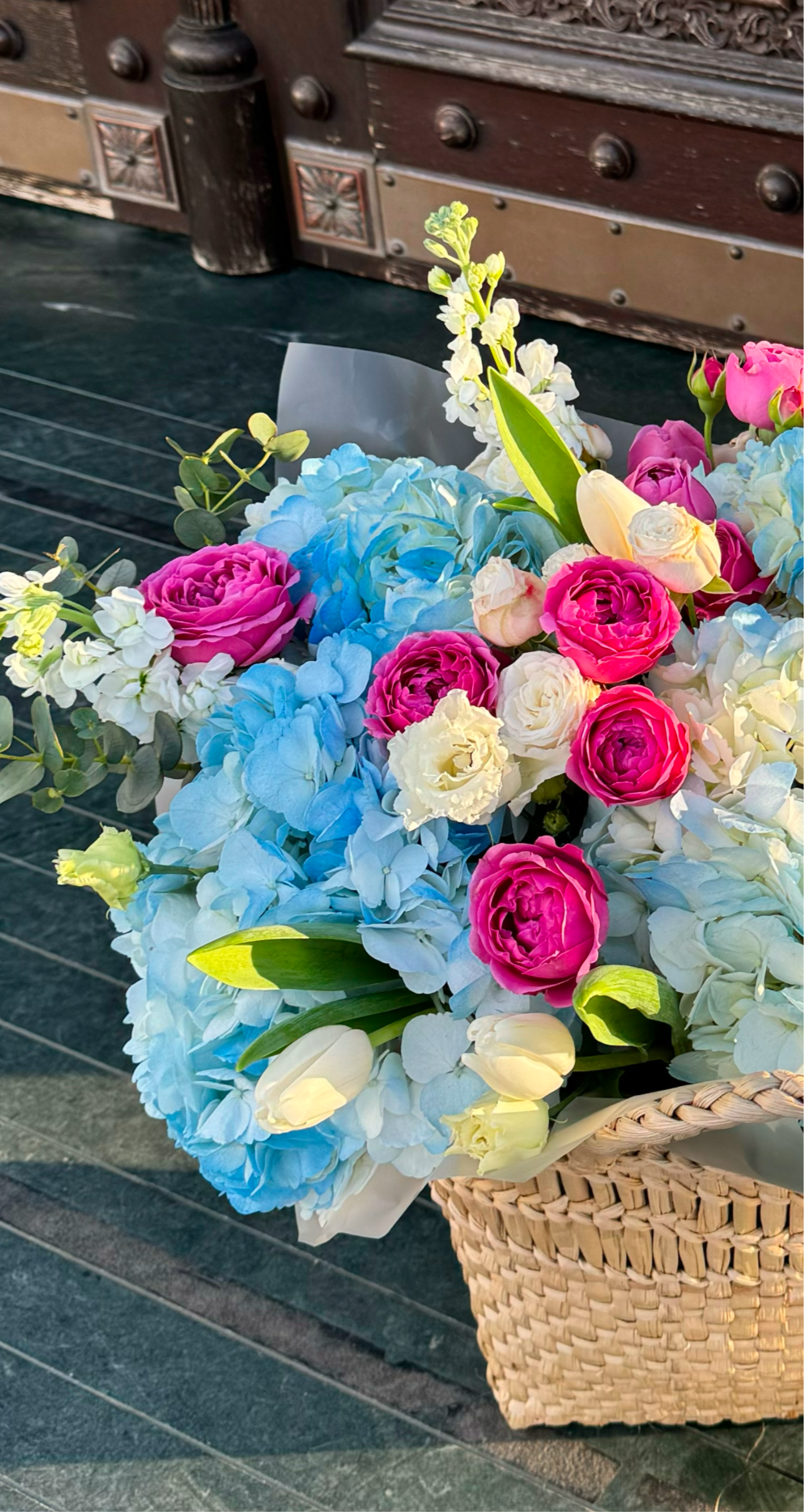 «Ocean bliss» basket with hydrangeas, roses, tulips, stock, eucalyptus