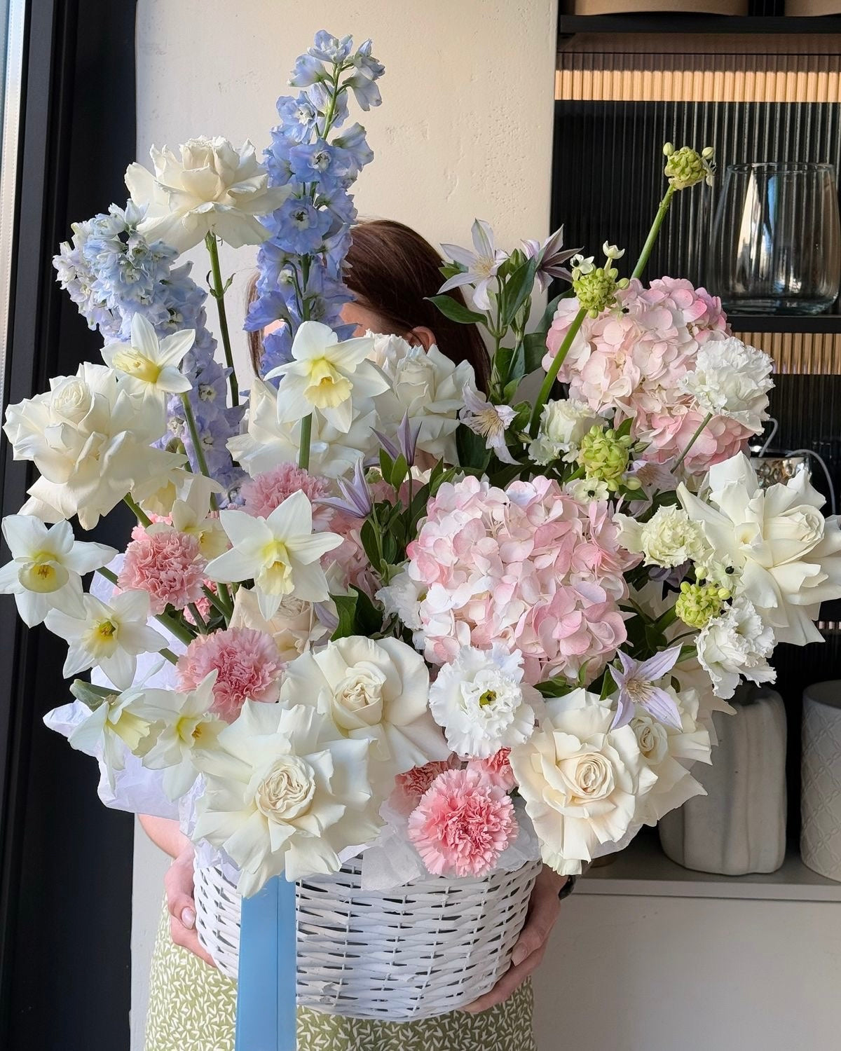 «Spring Whispers» Basket Arrangement, hydrangeas, French roses, delphinium, carnations, lizianthus